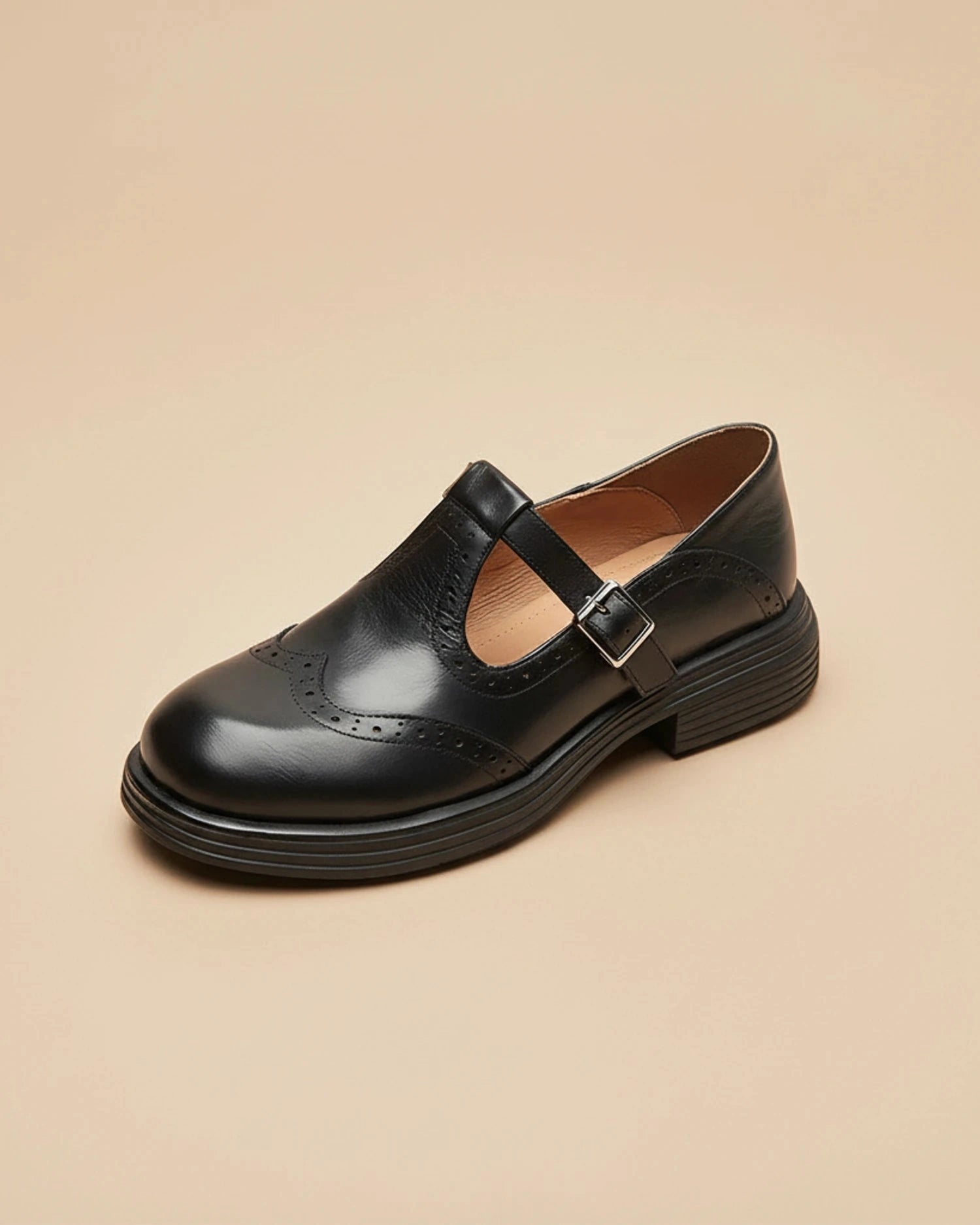 View of stylish supportive Mary Jane shoes in black leather, featuring a rounded toe and adjustable strap
