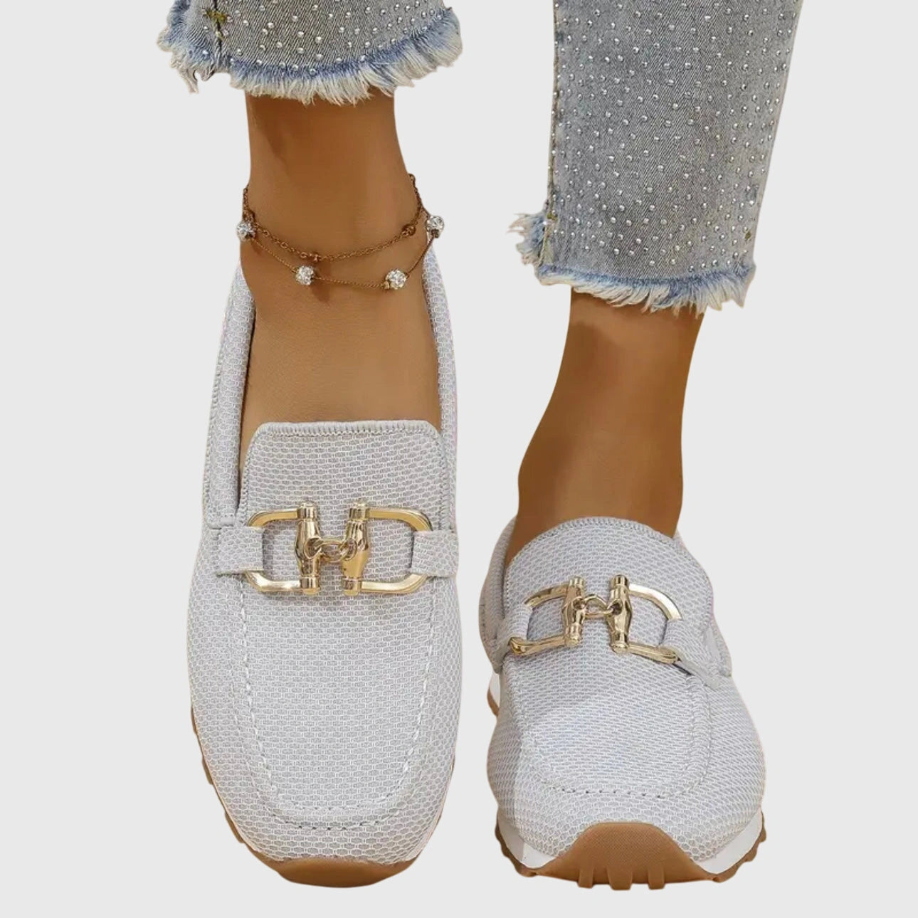 View of chic women's slip on loafers in soft beige leather, featuring a sleek silhouette and comfortable cushioned insole