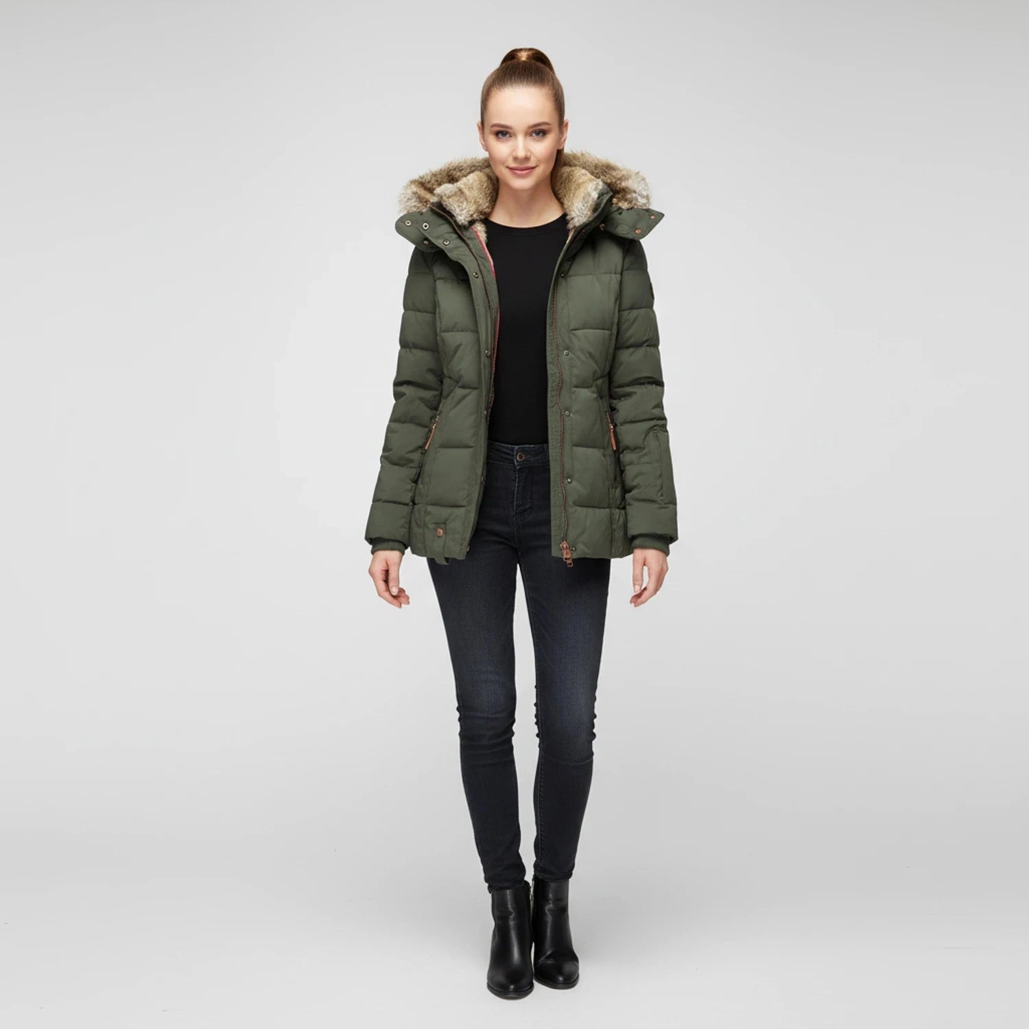 View of a fitted winter puffer jacket in deep green, featuring a high collar and quilted texture