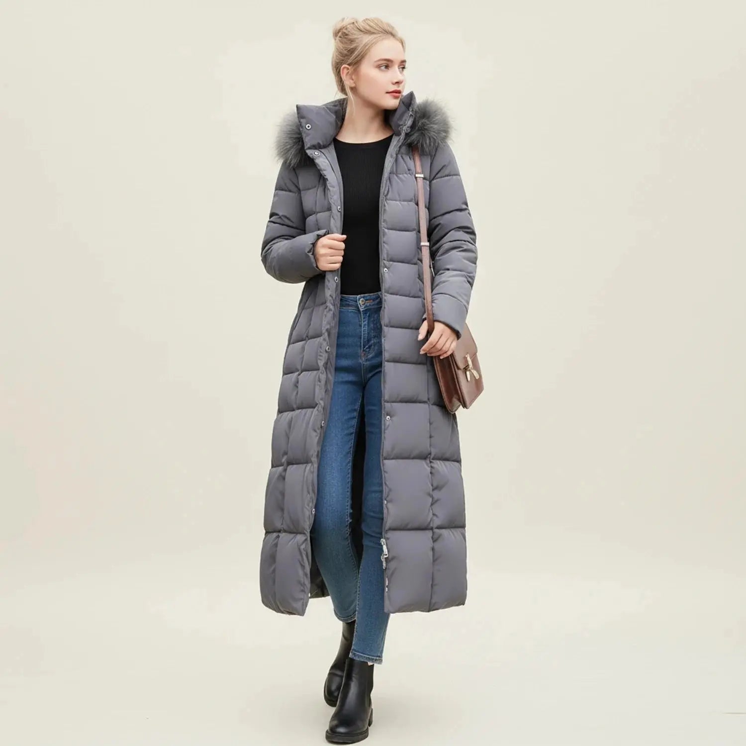 View of a chic women's quilted winter jacket in deep burgundy, featuring a high collar and stylish stitching details