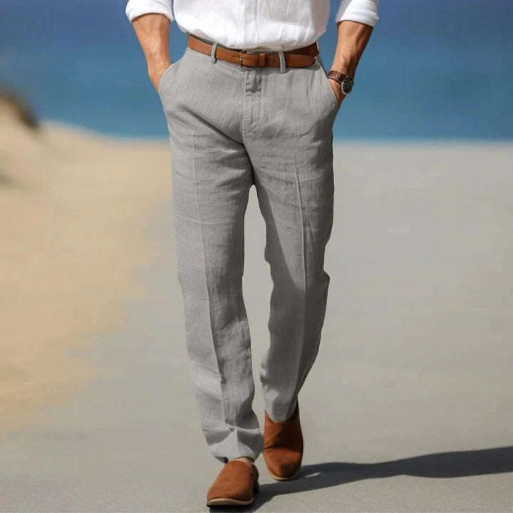 View of refined dress pants in charcoal gray fabric, featuring a tailored fit and subtle texture