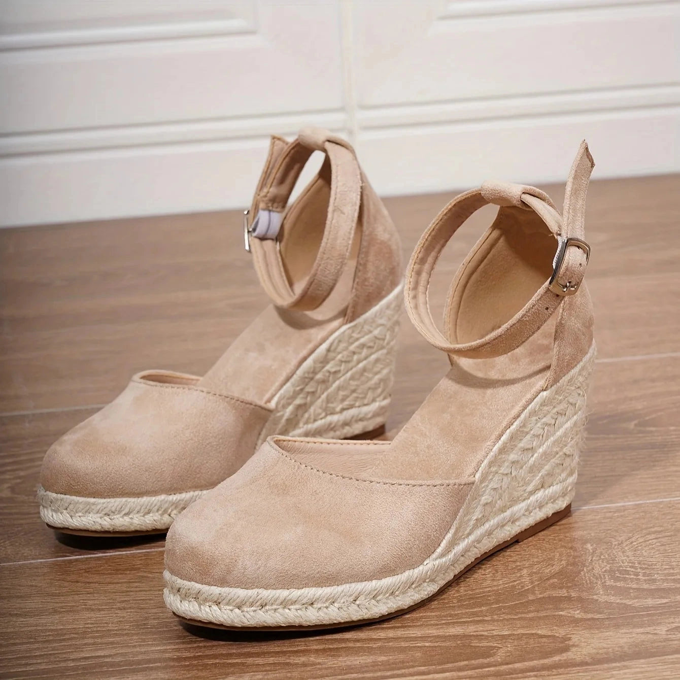 View of chic supportive platform shoes in soft beige suede, featuring a stylish rounded toe and sturdy sole