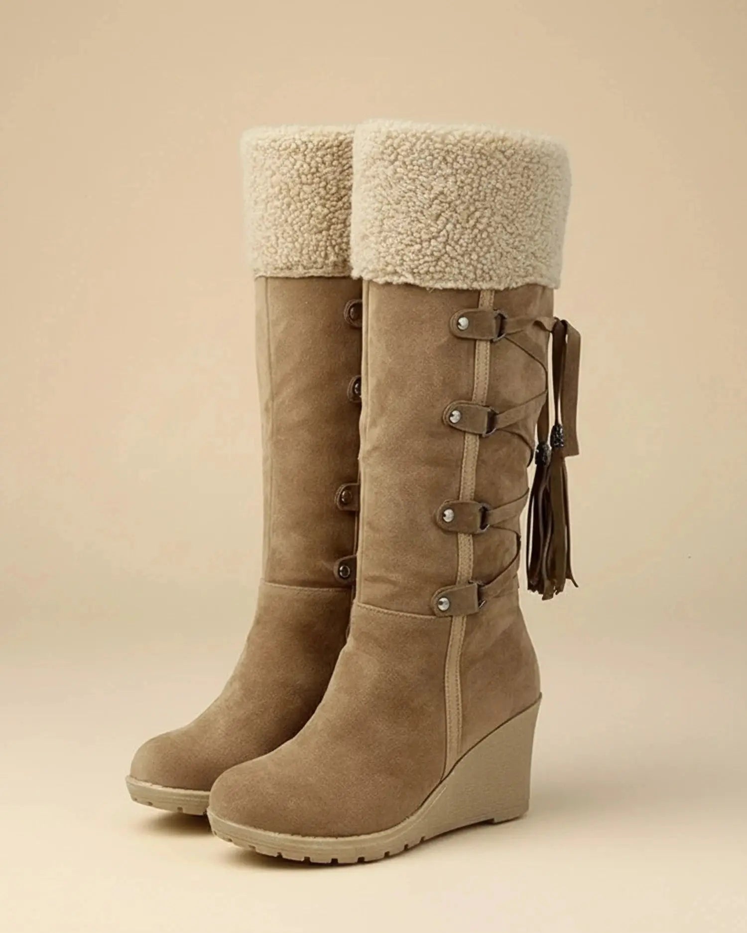 View of elegant cozy winter boots in soft gray suede, featuring a plush lining and decorative stitching details