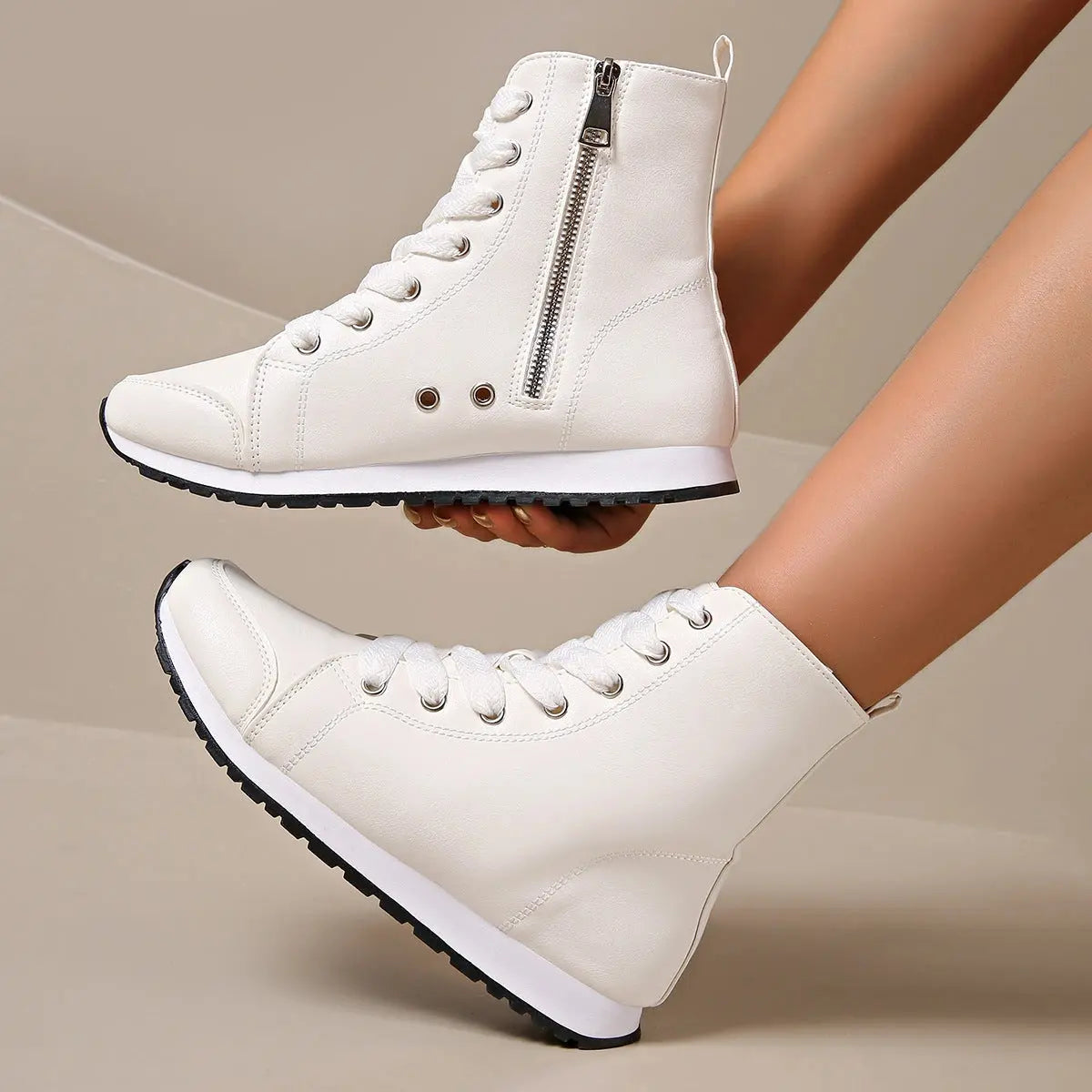 View of women's chic supportive sneakers in light gray mesh, featuring a cushioned sole and stylish lace up design