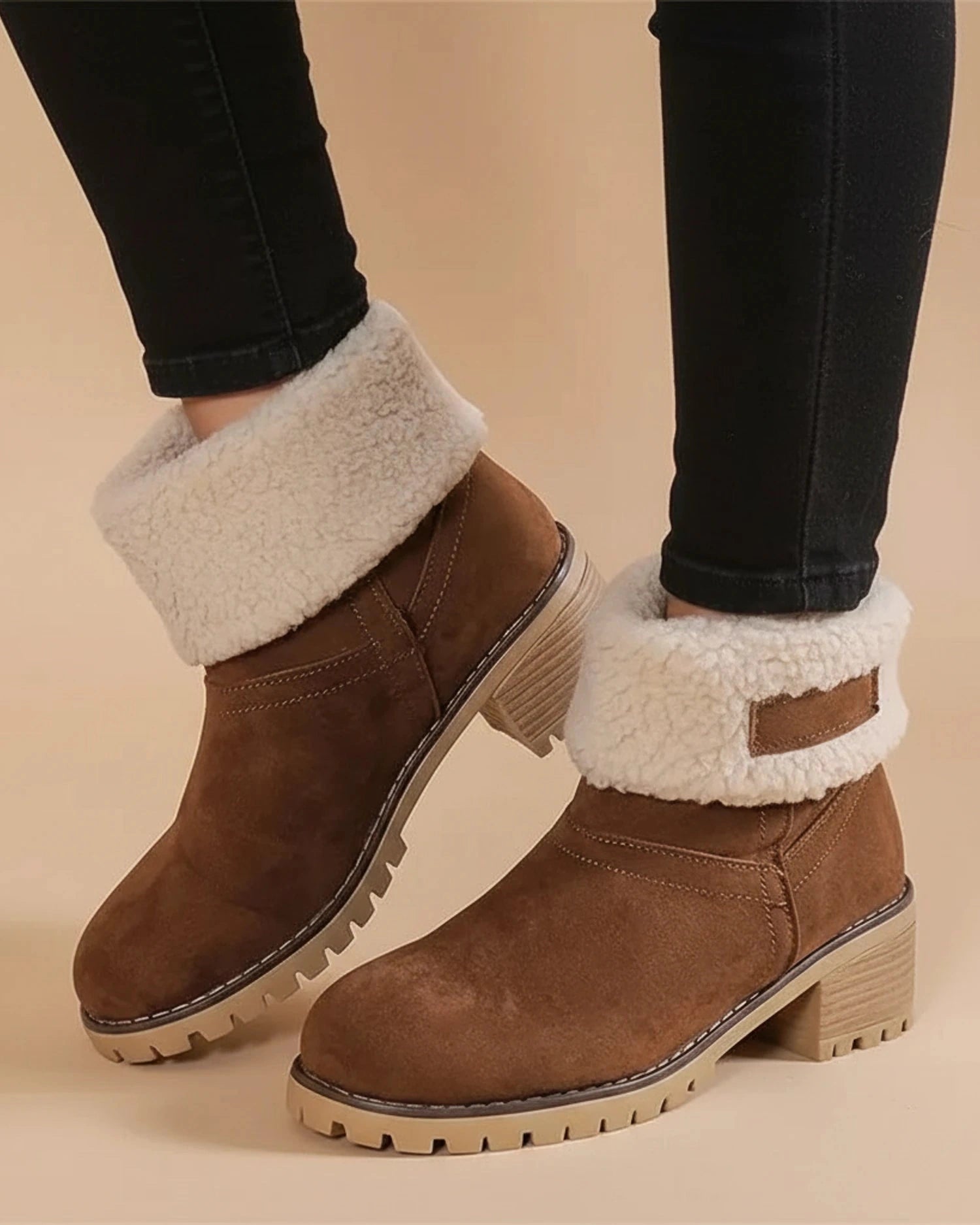 View of stylish women's ankle boots in rich brown leather, featuring a sleek design and comfortable low heel
