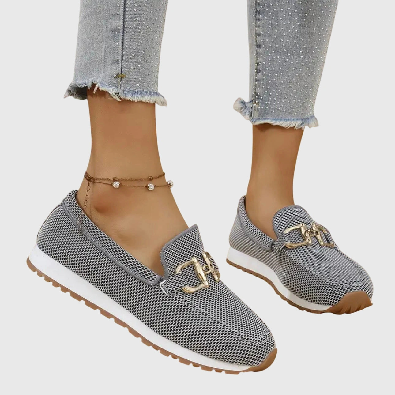 View of women's chic slip on loafers in soft beige suede, featuring a sleek silhouette and subtle stitching accents