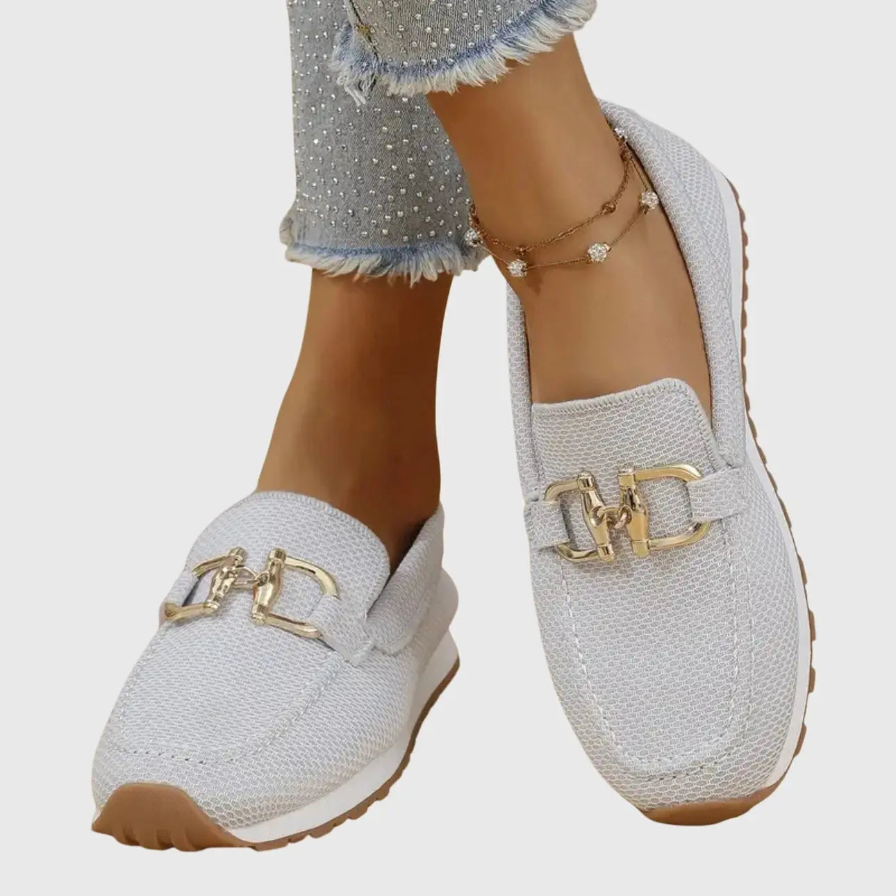 View of women's chic slip on loafers in soft beige suede, featuring a rounded toe and minimalistic design