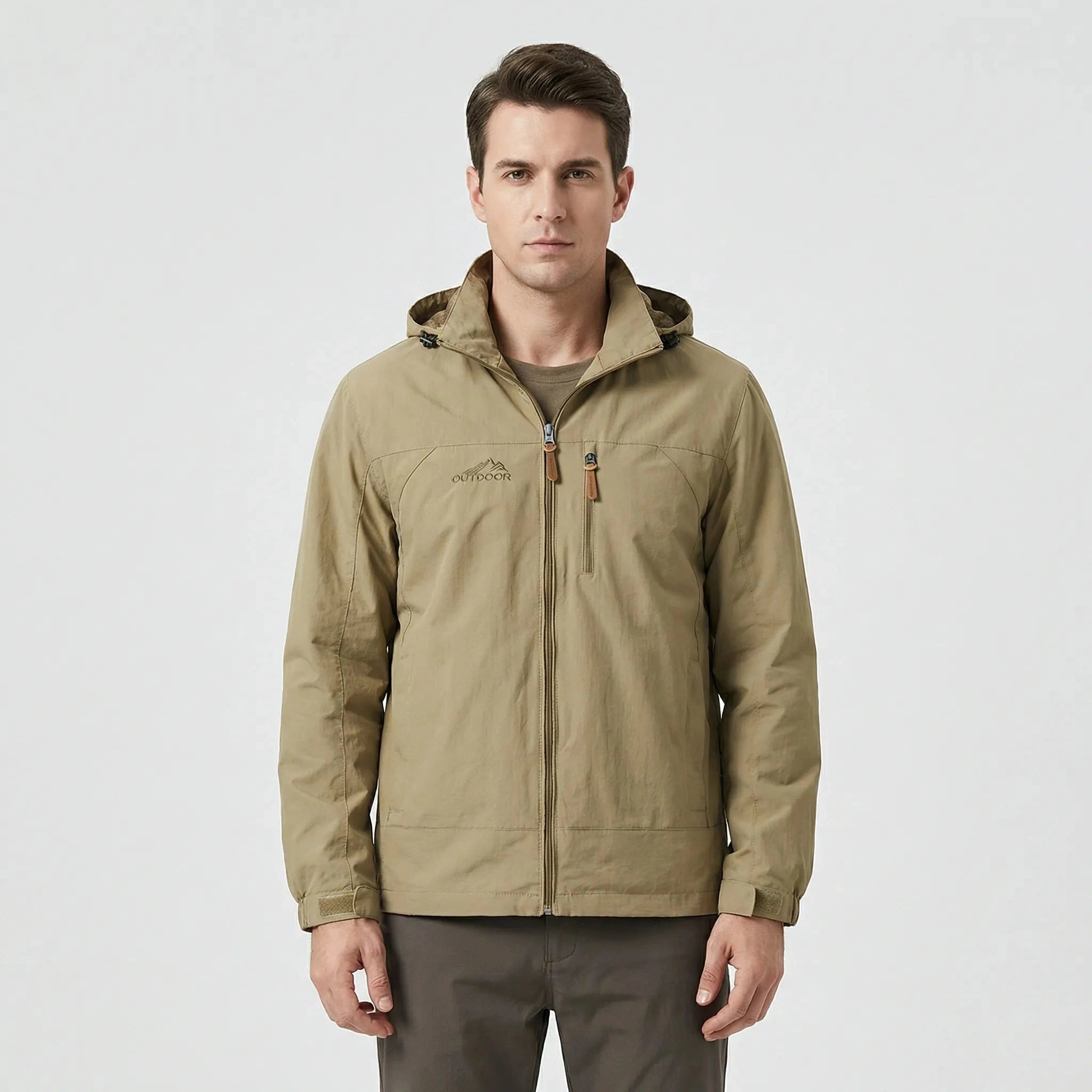 View of a water repellent outdoor jacket in dark green, featuring a high collar and zippered pockets