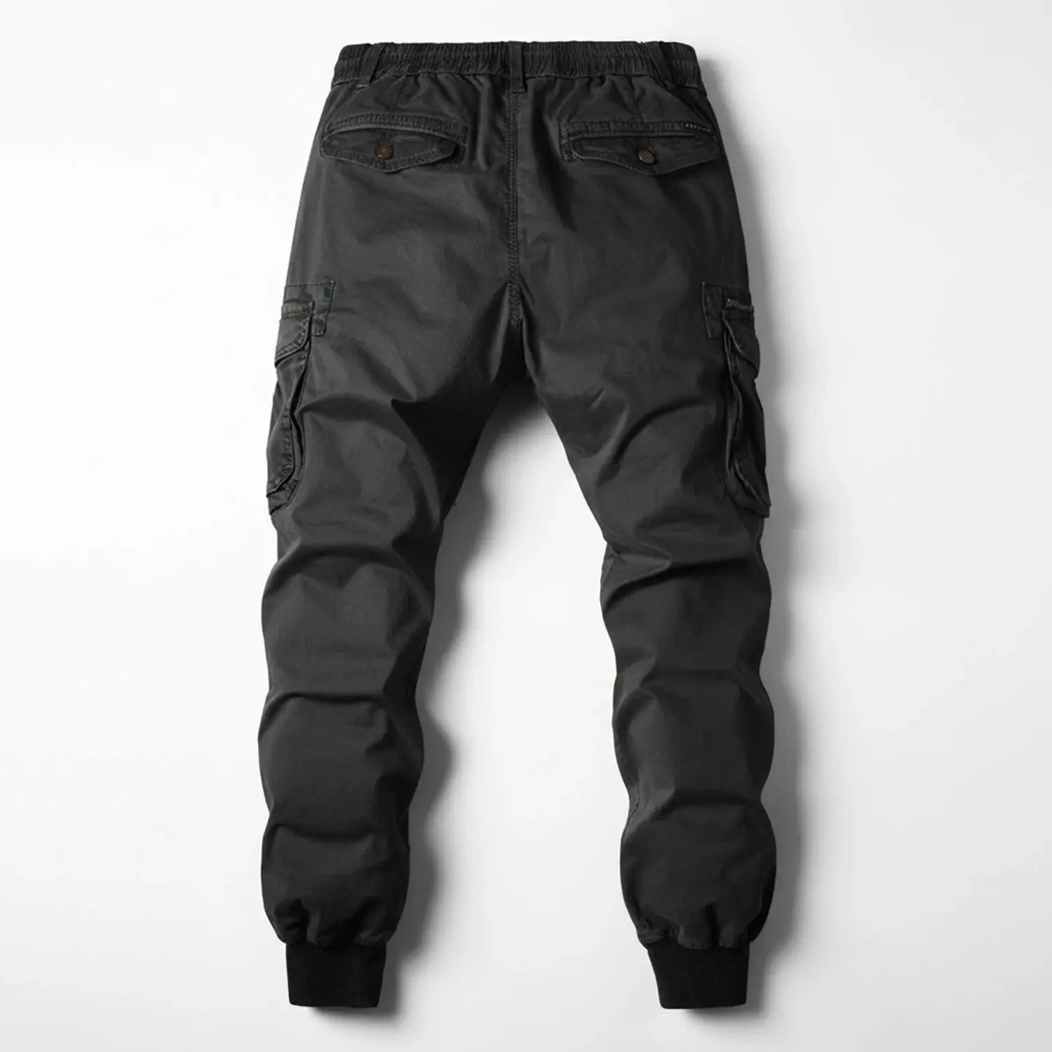 View of relaxed utility summer cargo jogger pants in olive green, featuring multiple pockets and a comfortable waistband
