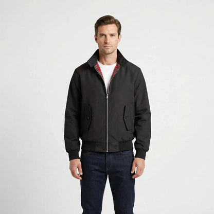 View of a classic winter jacket in deep navy, featuring a textured fabric, sleek silhouette, and subtle stitching accents