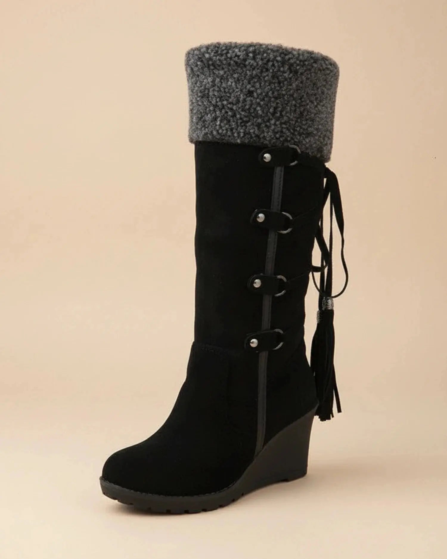 View of elegant women's winter boots in soft gray suede with a cozy fur lining and sturdy rubber sole