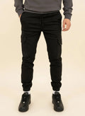 View of modern slim tapered cargo pants in olive green, made