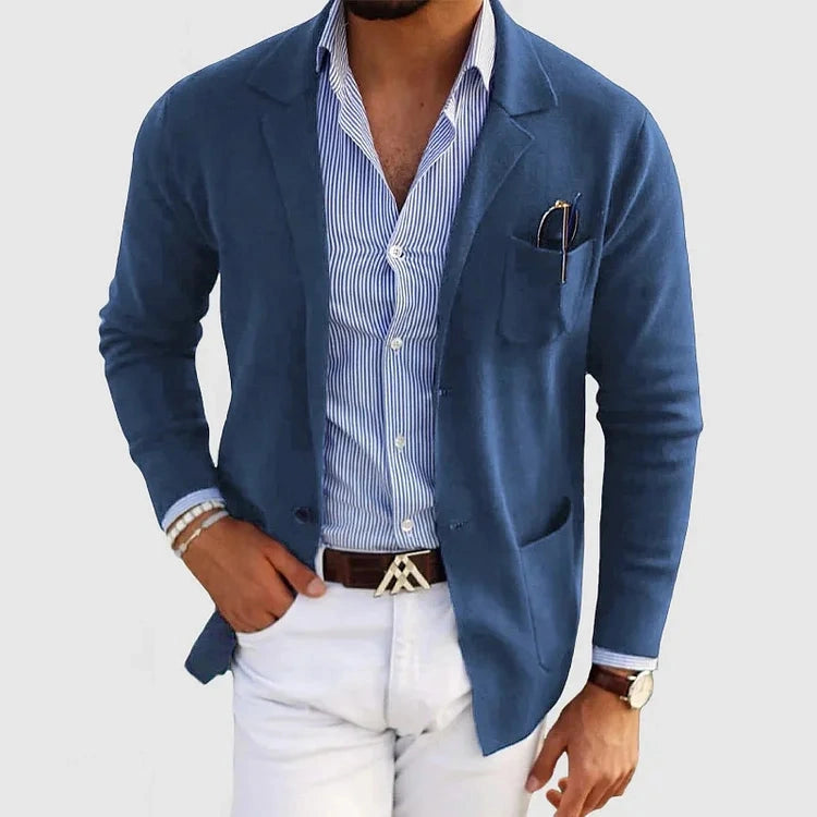 View of a polished relaxed blazer in dark gray, featuring a tailored fit and smooth fabric