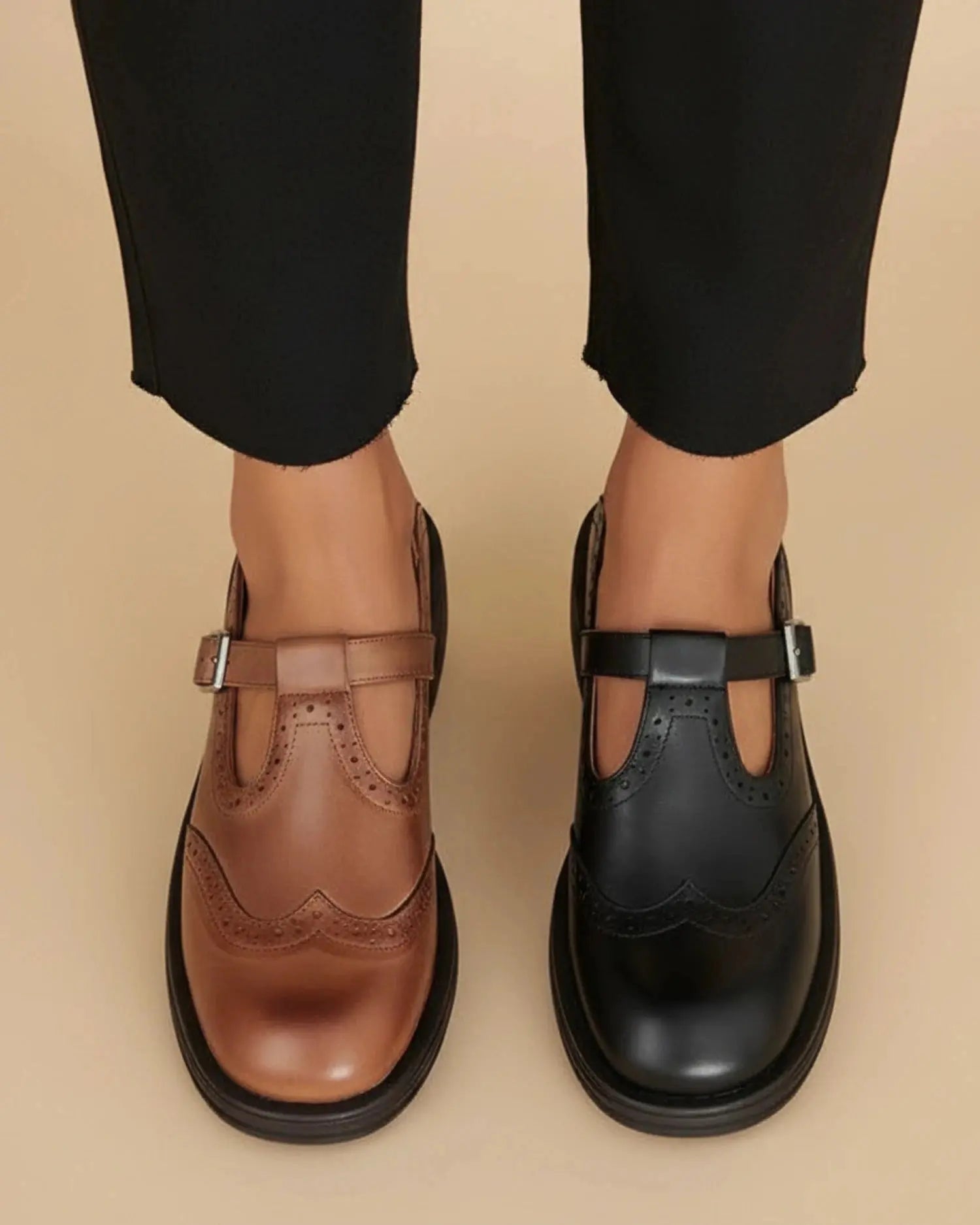 View of stylish supportive Mary Jane shoes in soft black leather, featuring a round toe and adjustable strap