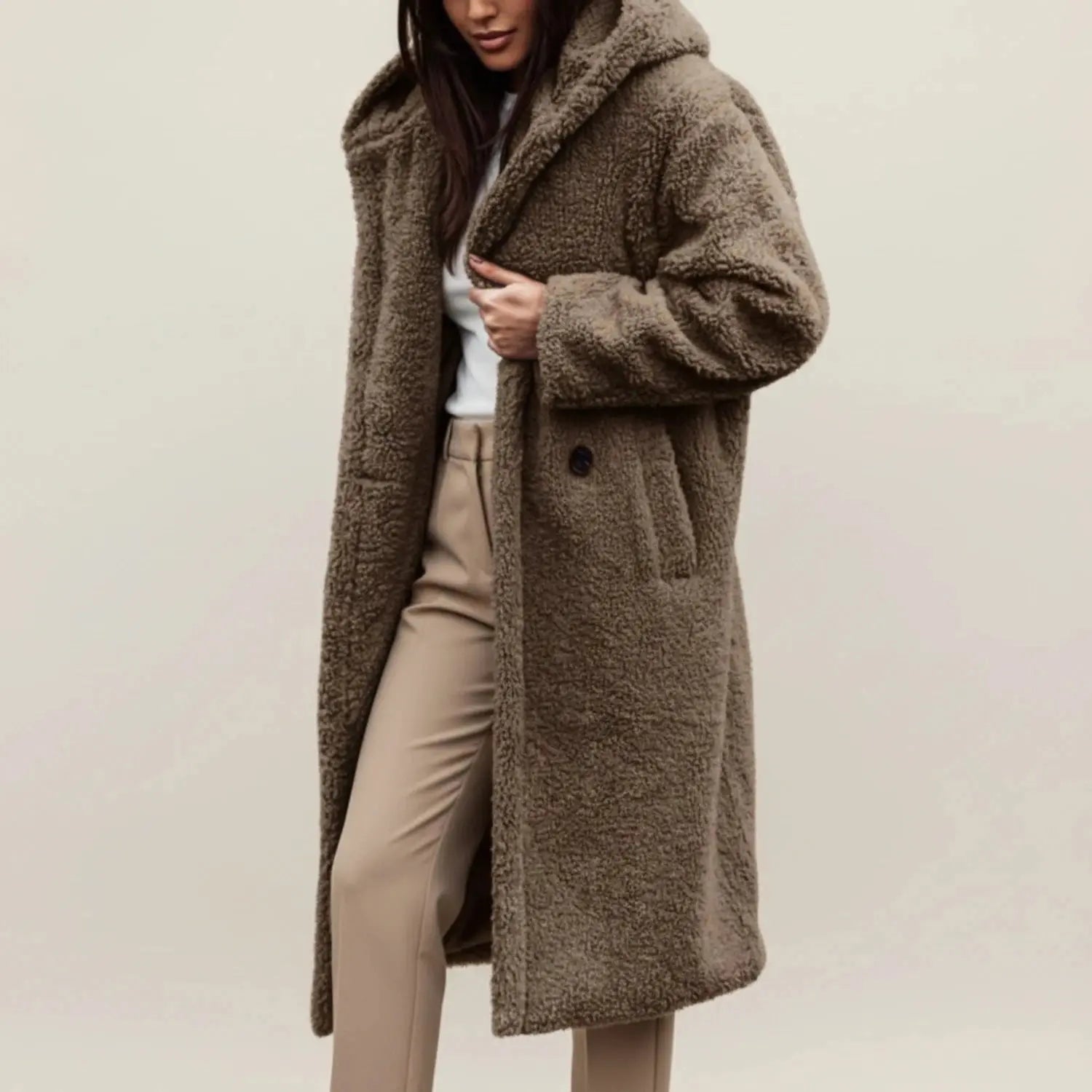 View of a cozy relaxed winter coat in soft gray fabric, featuring a hood and button closure