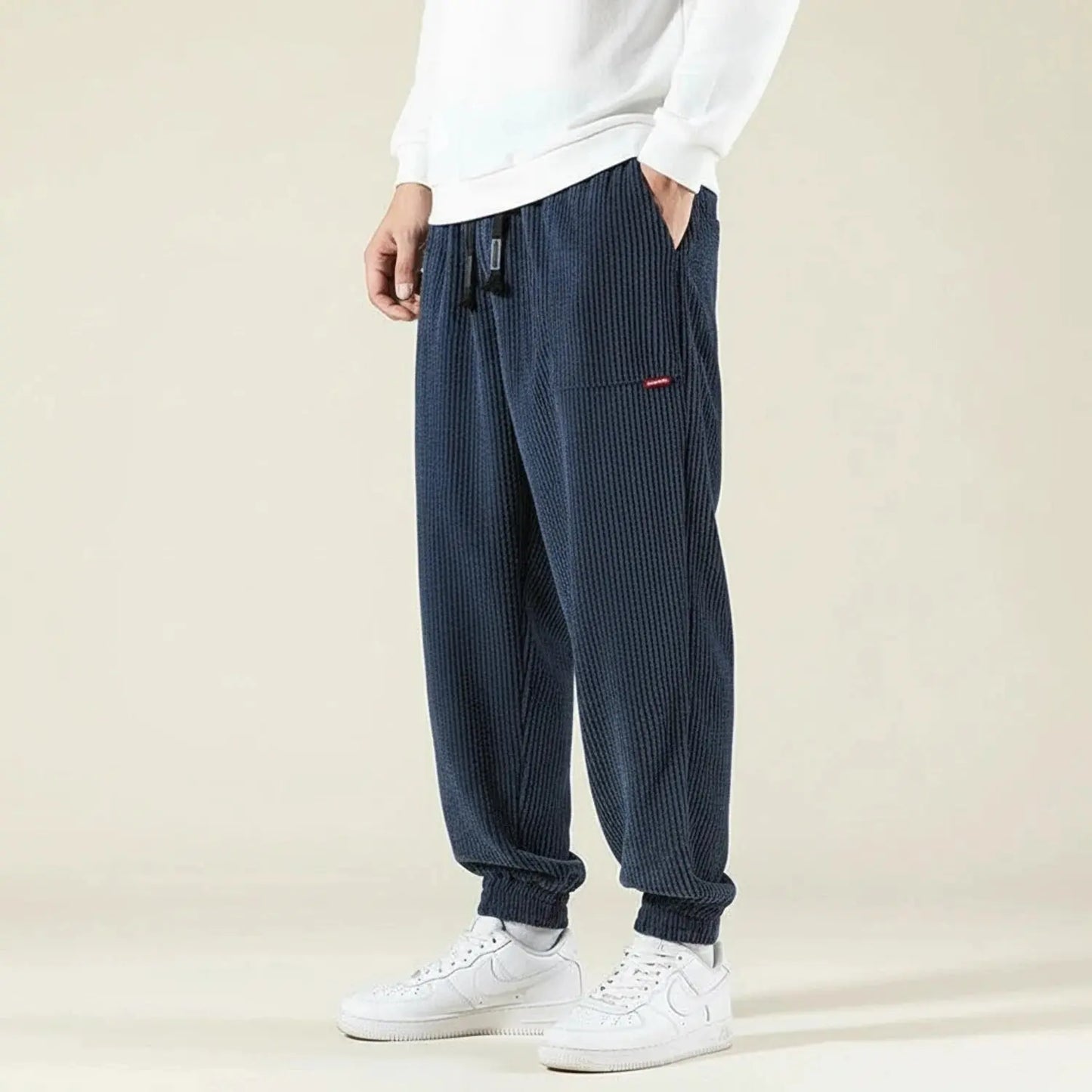 View of relaxed fit jogger pants in dark gray, made