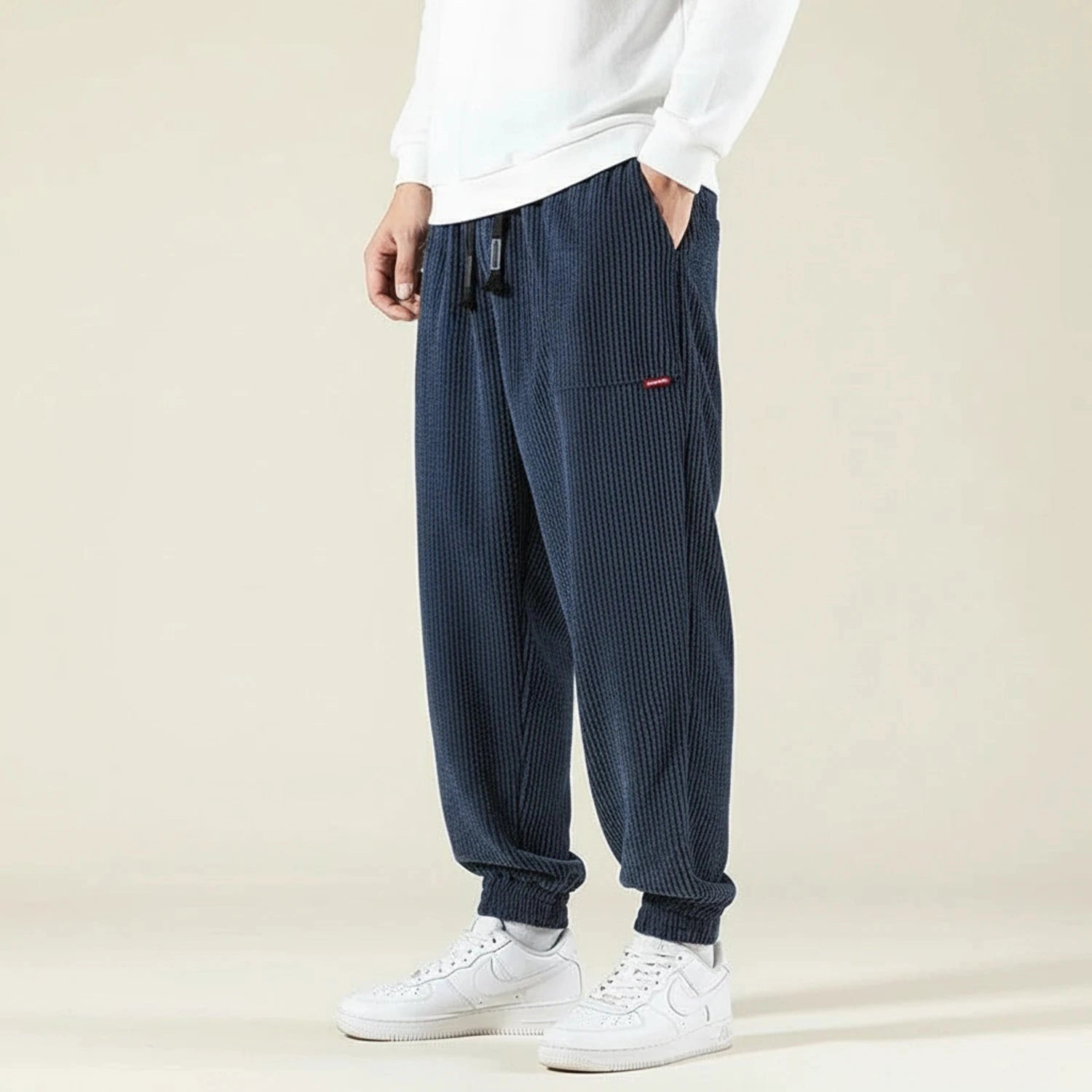 View of relaxed fit jogger pants in dark gray, made