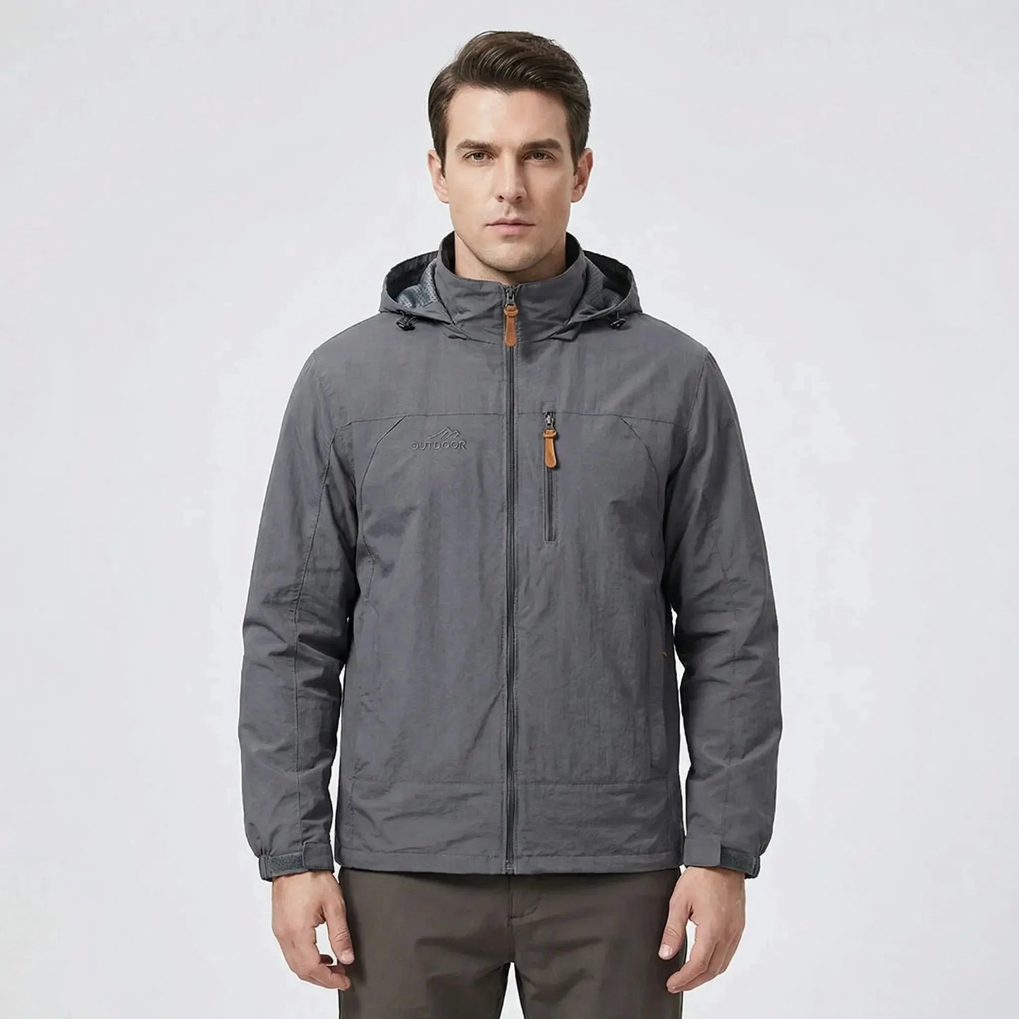 View of a men's outdoor jacket in dark green, featuring water repellent material, adjustable cuffs, and a high collar