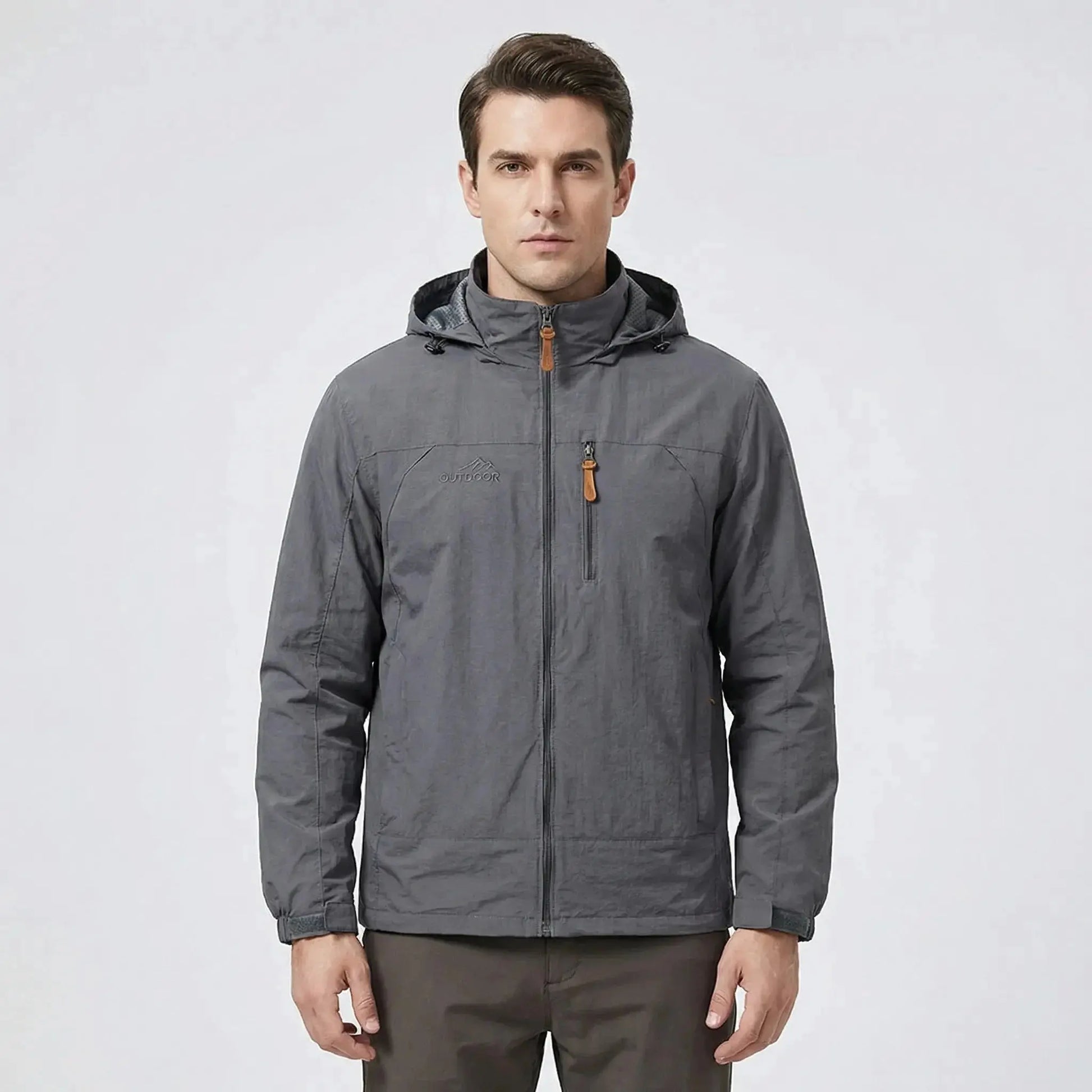 View of a men's outdoor jacket in dark green, featuring water repellent material, adjustable cuffs, and a high collar