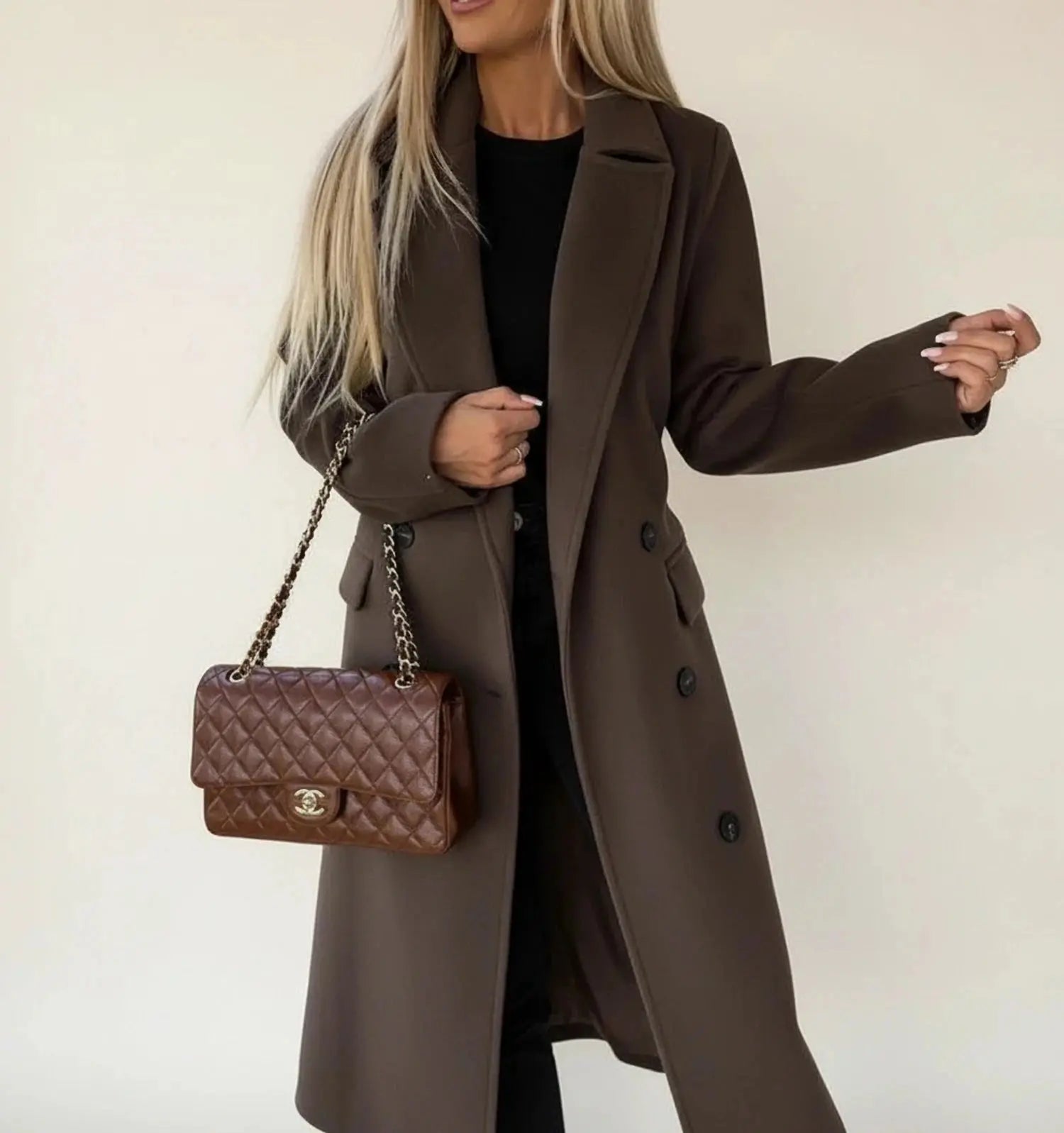View of a sophisticated women's winter overcoat in deep burgundy, featuring a tailored fit and elegant collar