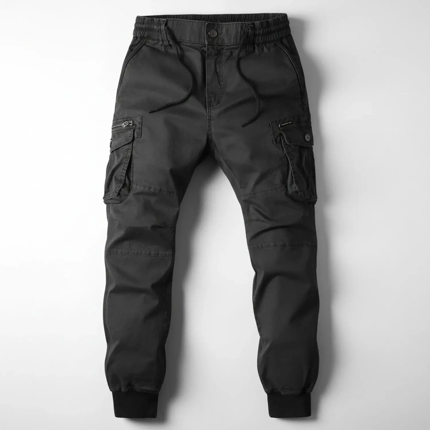 Light gray relaxed utility cargo jogger pants made from breathable fabric, featuring multiple pockets and an elastic waistband, view