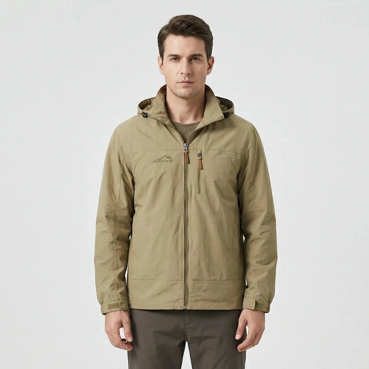 View of a water repellent outdoor jacket in dark green, featuring a high collar and zippered pockets