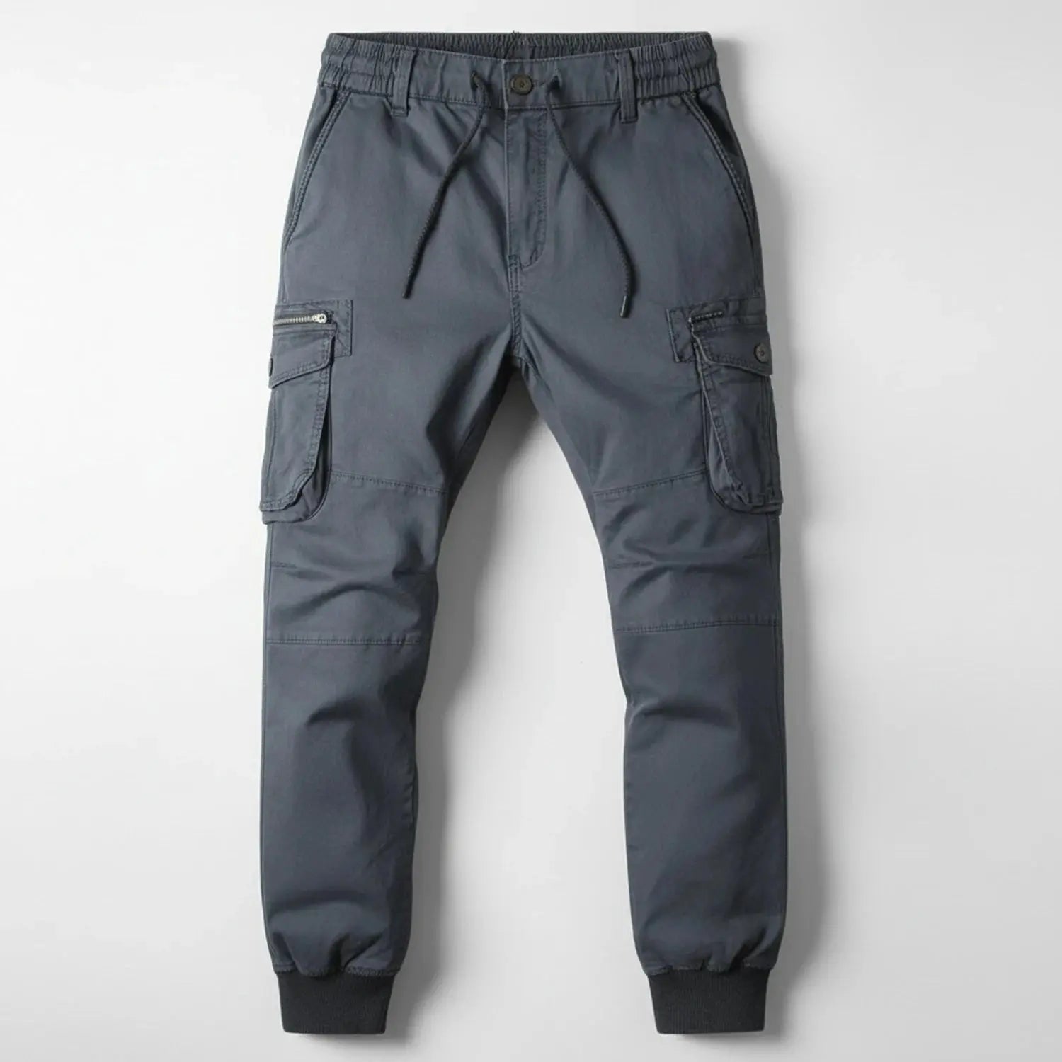View of relaxed utility summer cargo jogger pants in olive green, featuring multiple pockets and a comfortable fit