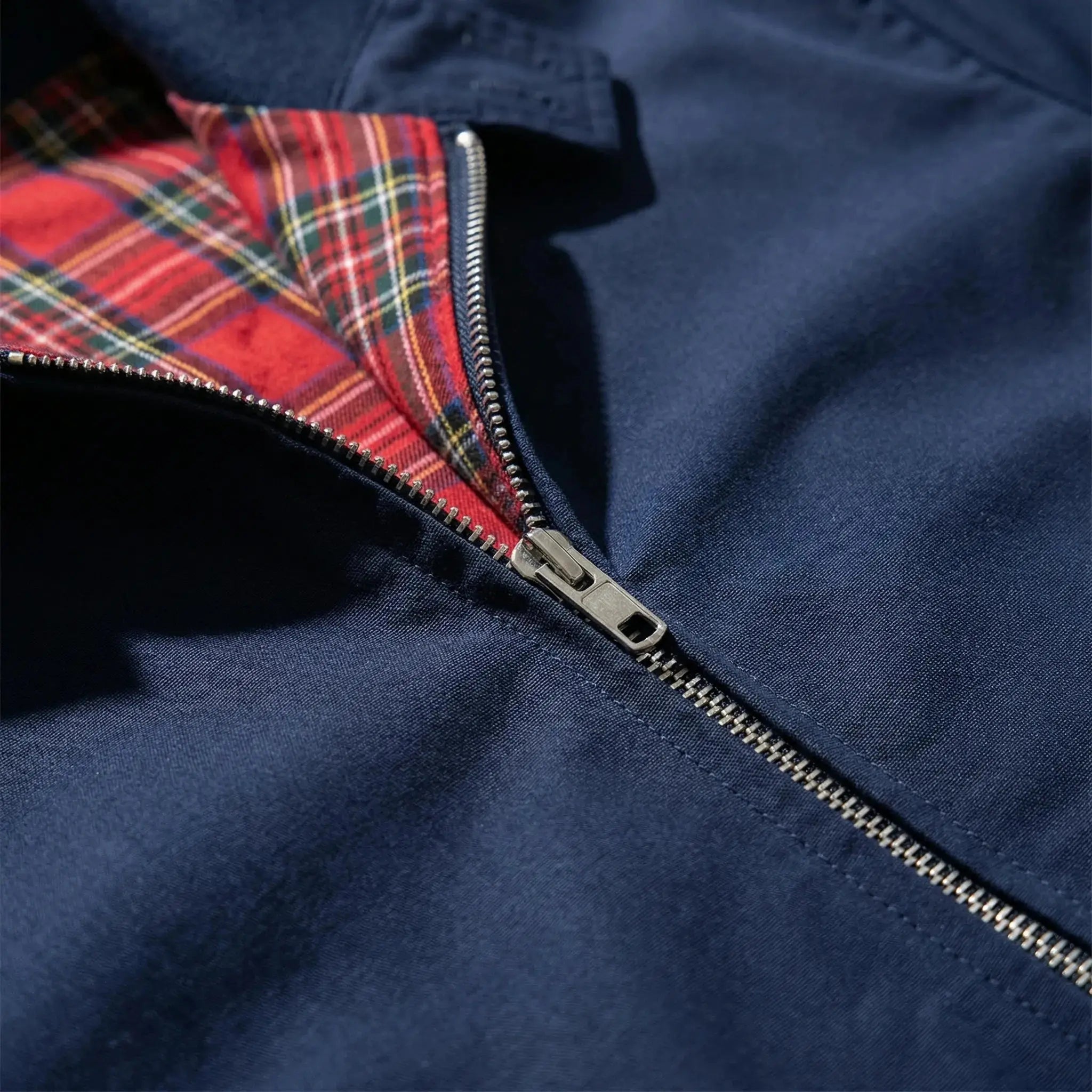 View of a dark gray winter jacket made from a soft wool blend, featuring a tailored fit and sleek silhouette