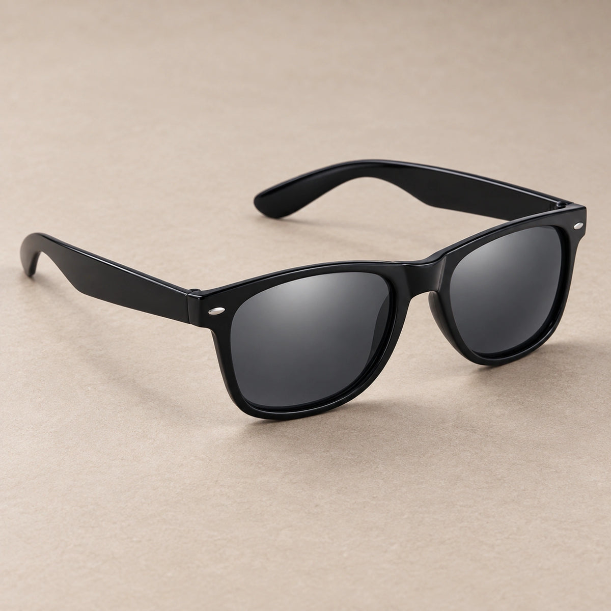 sunglasses — Black Charcoal eyewear, complete individual pair on warm neutral stone; product angle — view 3