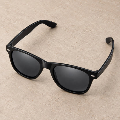 sunglasses — Black Charcoal eyewear, complete individual pair on warm neutral stone; product angle — view 4