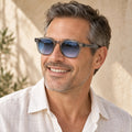sunglasses — Noah square eyewear in Grey Blue Gradient, worn by a happy adult model