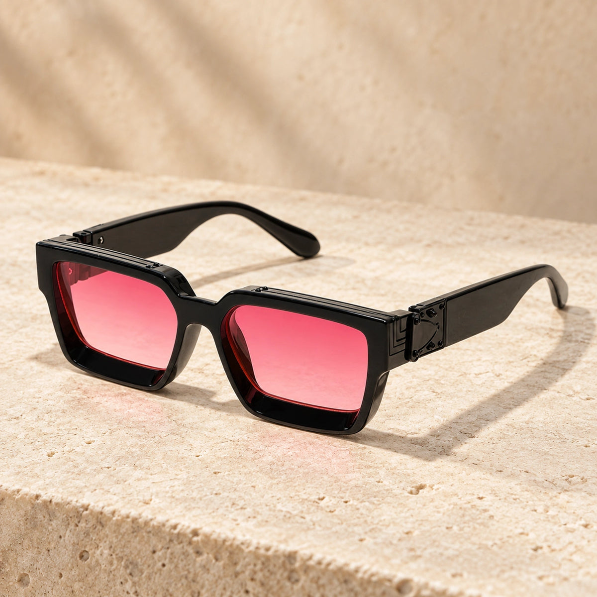 Small Black Pink Gradient sunglasses, complete pair on a warm neutral stone surface. — view 12