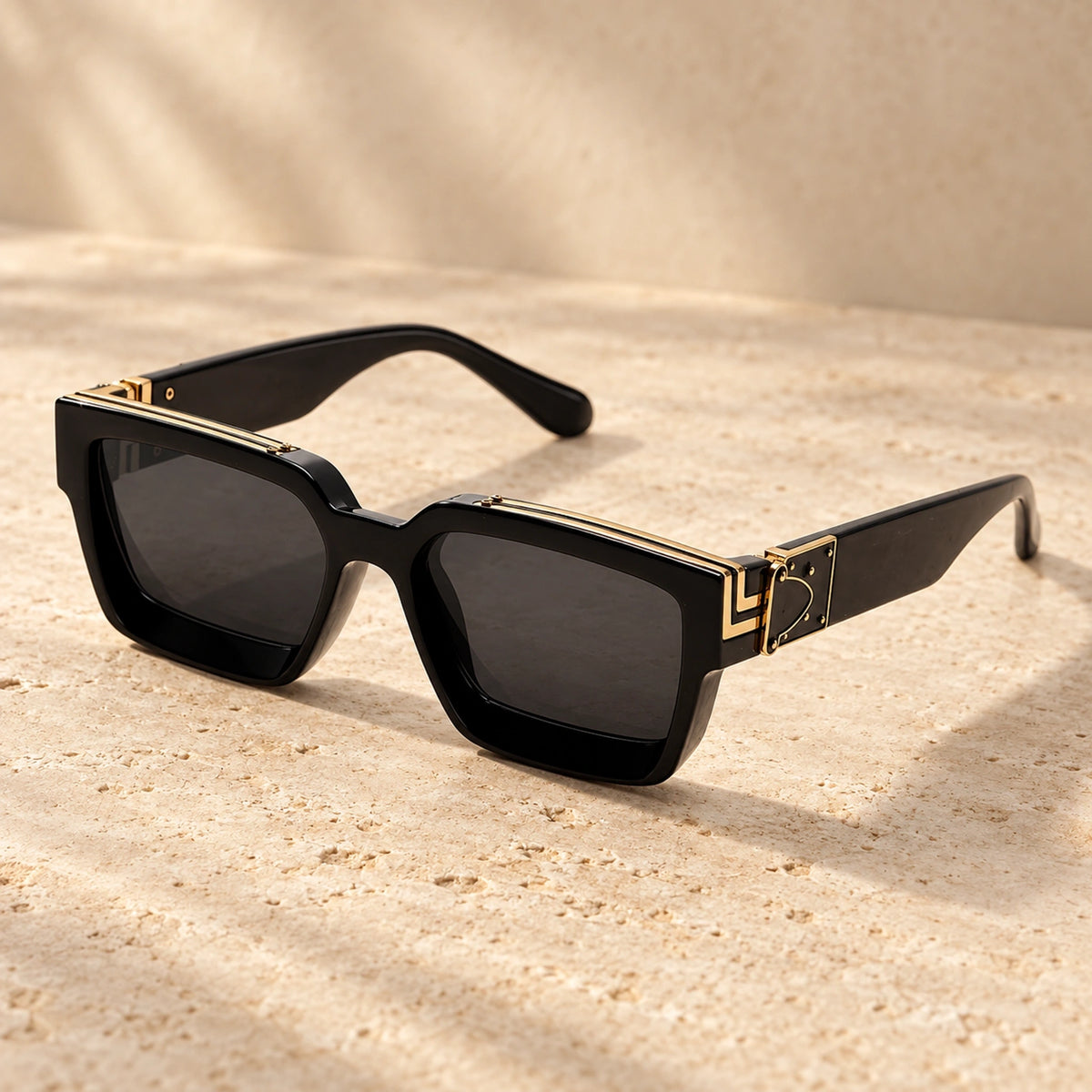 Small Gold Black Charcoal sunglasses, complete pair on a warm neutral stone surface. — view 6