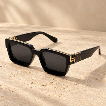 Small Gold Black Charcoal sunglasses, complete pair on a warm neutral stone surface. — view 6
