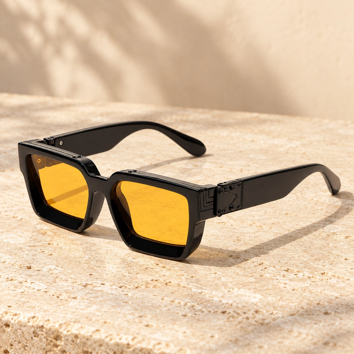 Small Black Yellow sunglasses, complete pair on a warm neutral stone surface. — view 7