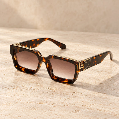 Small Tortoiseshell Brown Gradient sunglasses, complete pair on a warm neutral stone surface. — view 9